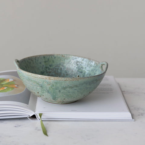 Creative Co-Op berry bowl close-up shows aqua reactive glaze and rustic texture.