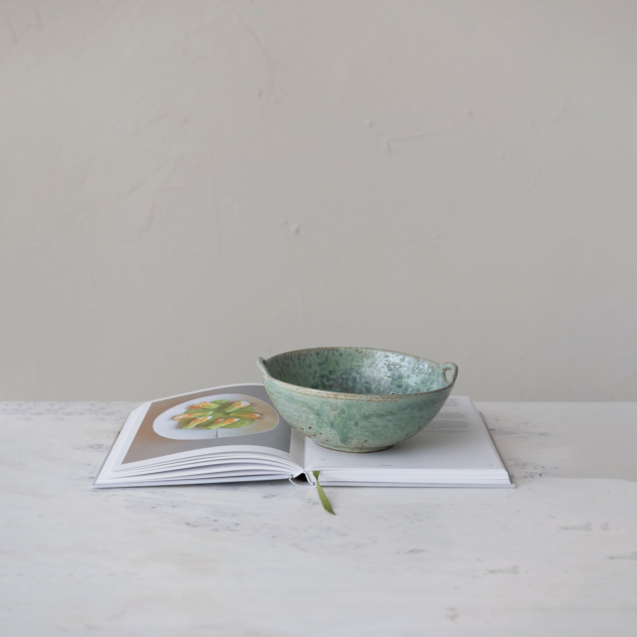Creative Co-Op berry bowl side view highlights integrated handles.