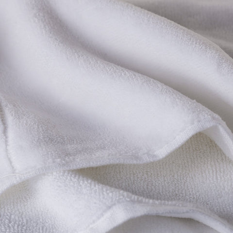 Creative Scents cotton towels on a rack, adds a clean welcoming bathroom vibe