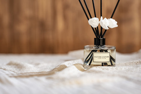 Culture & Nature reed diffuser in a bedroom creating a peaceful ambiance