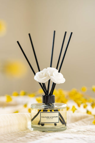 Reed diffuser with wooden base adds a subtle decorative touch to any space.