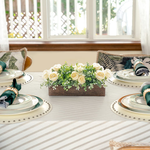 Dahey centerpiece dining table display with artificial blooms and eucalyptus.