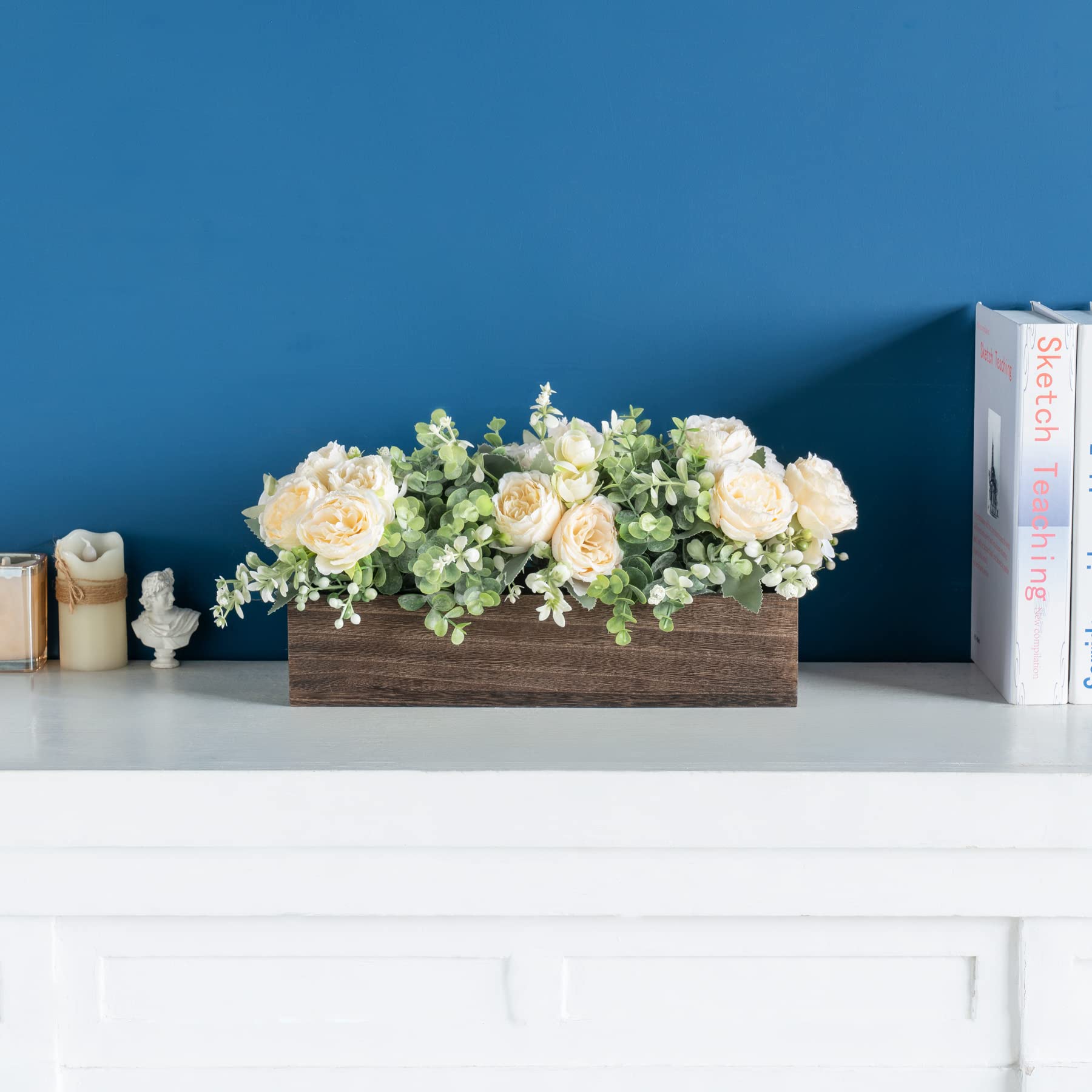 Dahey centerpiece eucalyptus leaves accenting the arrangement.