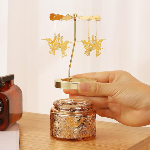 DAISRED hummingbird candle on a bedside table for relaxation.