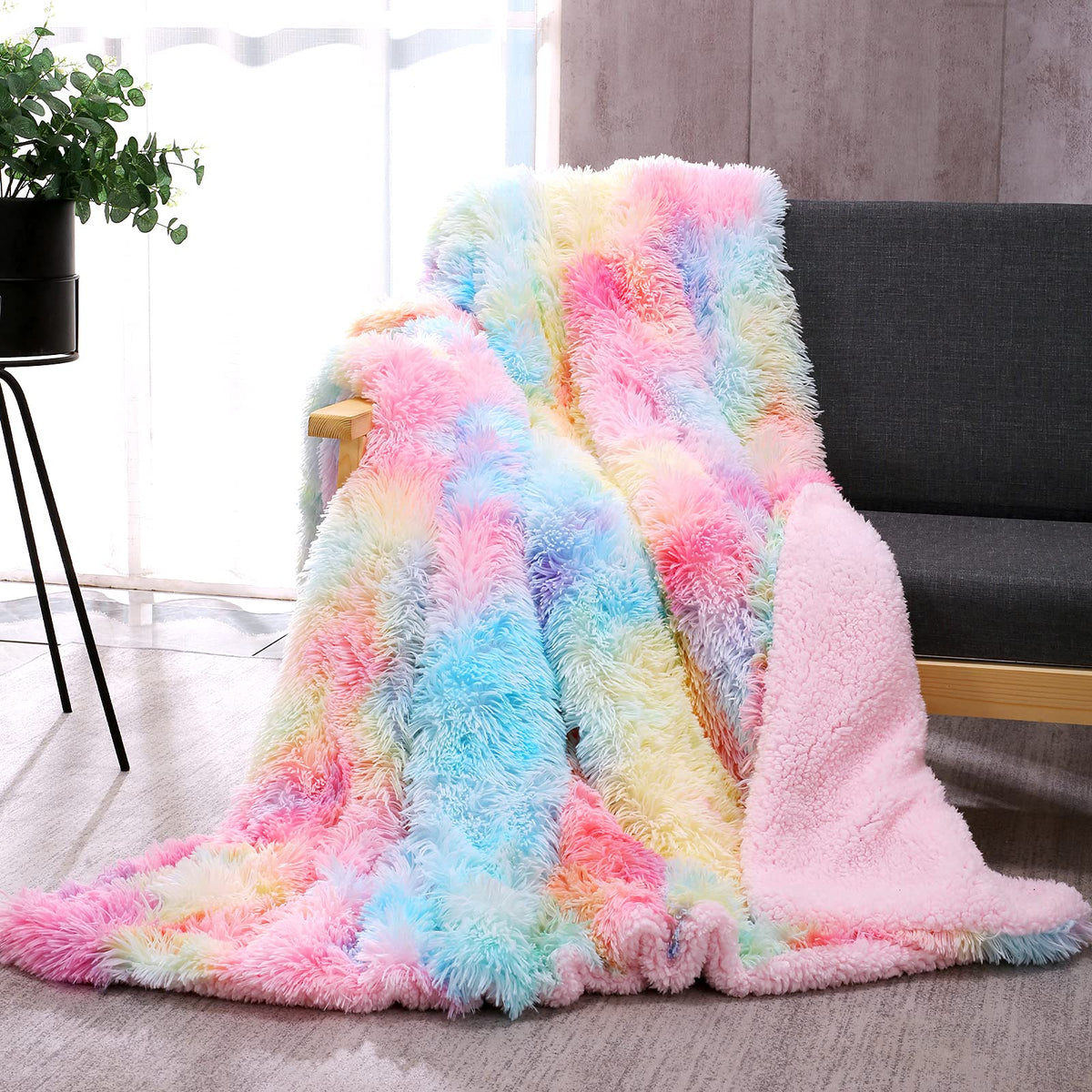 DANGTOP rainbow fuzzy throw blanket on sofa adds cozy décor.