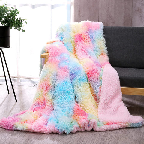 DANGTOP rainbow fuzzy throw blanket on sofa adds cozy décor.