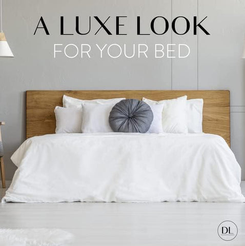 Danjor Linens king bed with cream sheets shows inviting sleeping surface.
