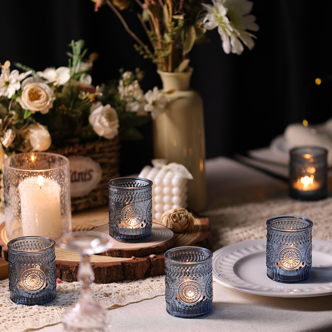 DARJEN blue votive candle holder enhances dining room lighting.