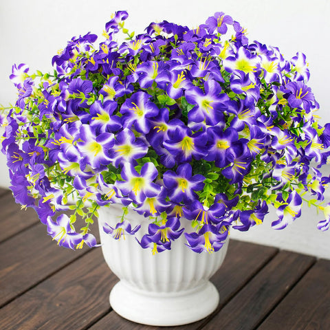 Daynight 32-pcs faux petunias add year-round color to porches and gardens.