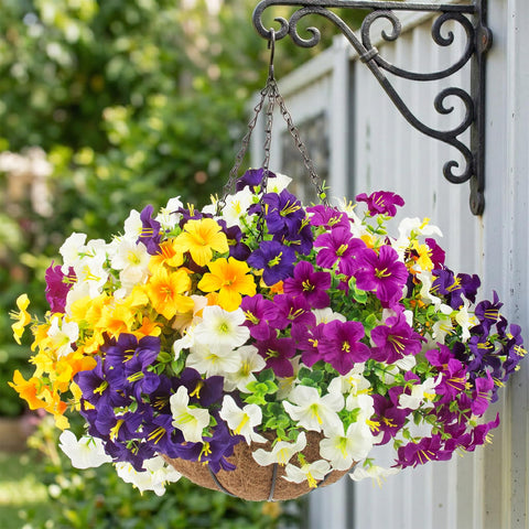 Purple and red-violet Daynight petunias in a decorative planter