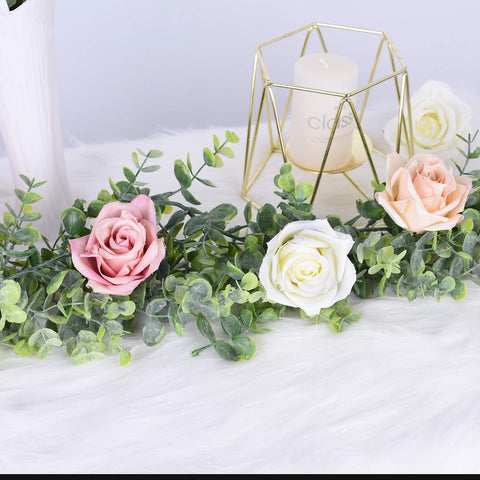 DearHouse garland creates a stunning wedding arch backdrop.