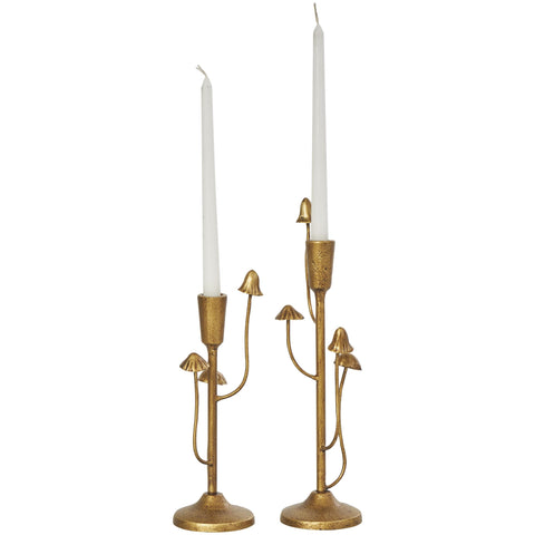 Deco 79 mushroom-inspired candle holder pair enhances a modern tabletop centerpiece