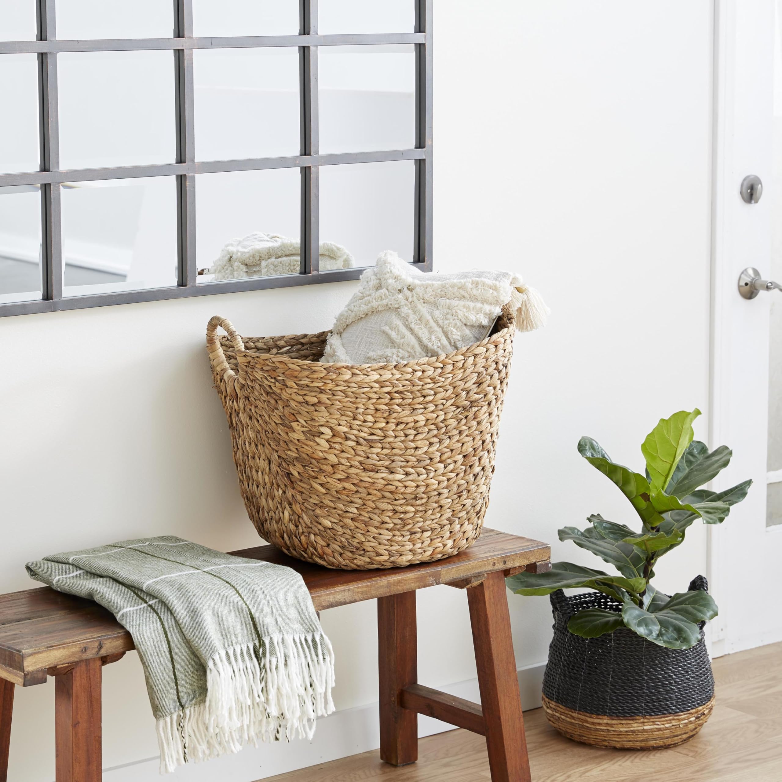 Deco 79 seagrass basket wide deep body provides ample storage for throws.