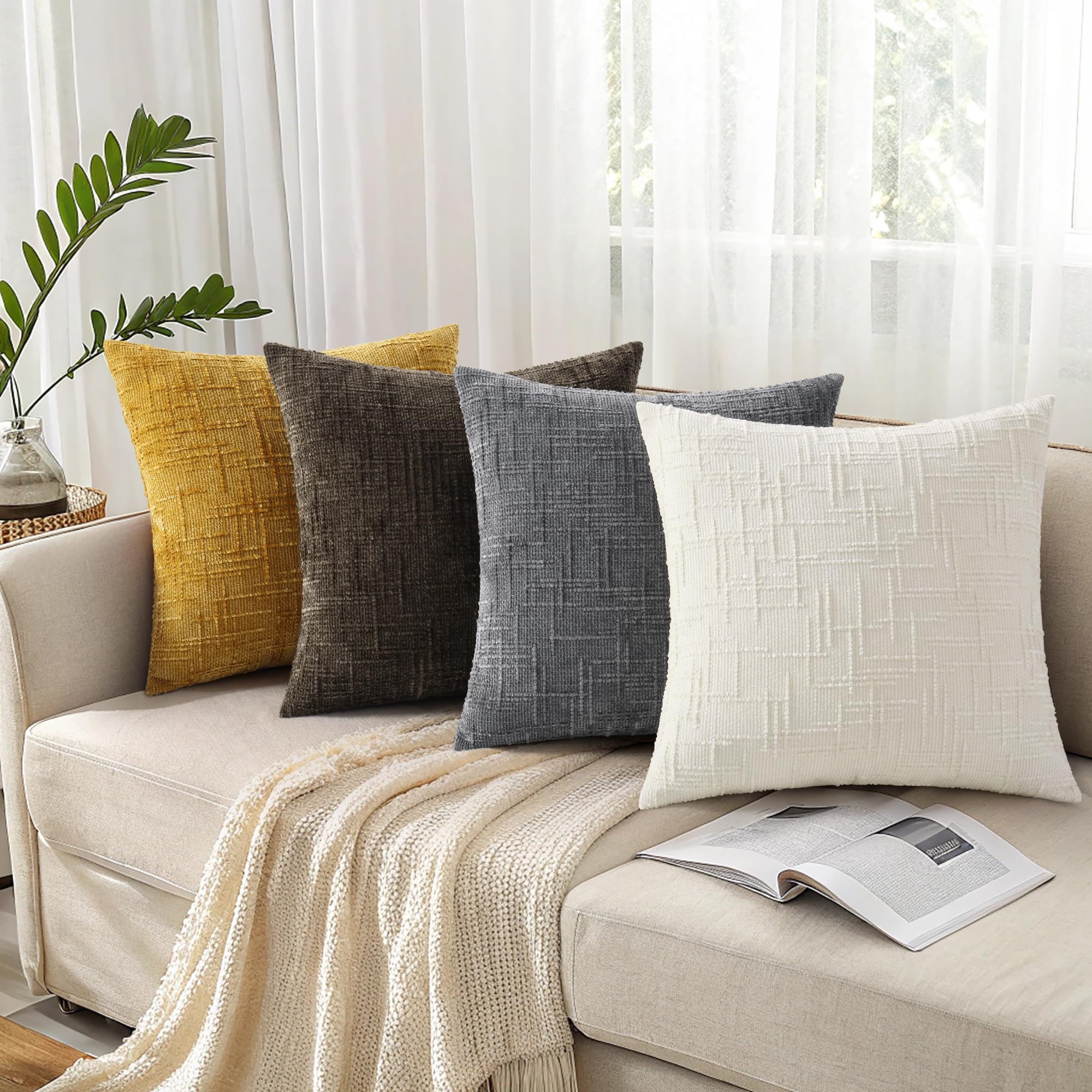 decorUhome set of 2 pillow covers shown on sofa and chair.