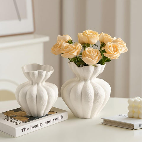 DecoVlog vase on living room shelf enhances decor display.