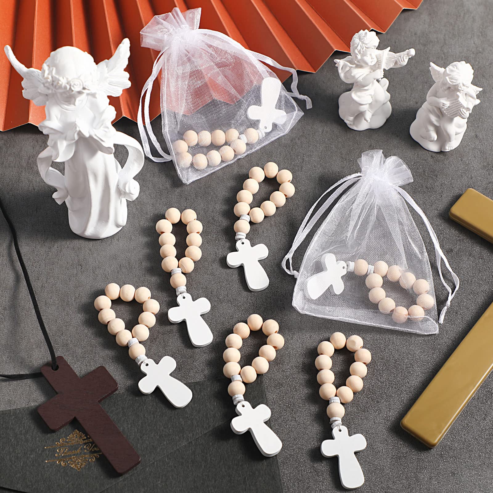 Deekin white cross pendant on rosary detail; elegant focal point for ceremonies.