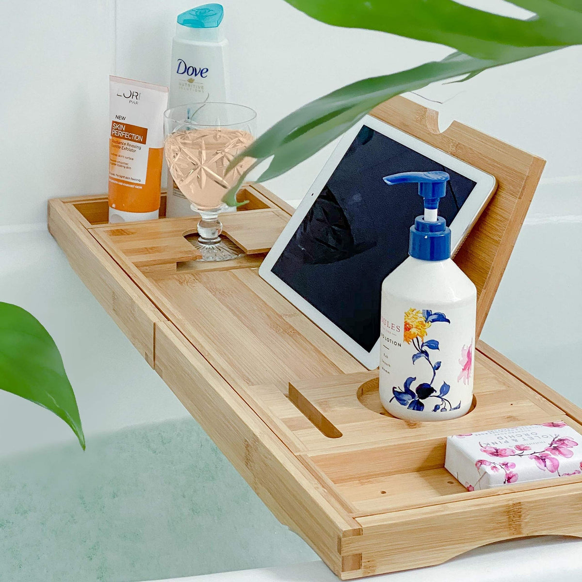 Deep Calm bathtub tray extends to fit large tubs for a seamless at-home spa.