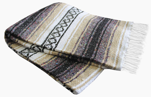 Del Mex Classic Blanket in car, convenient travel throw for road trips.