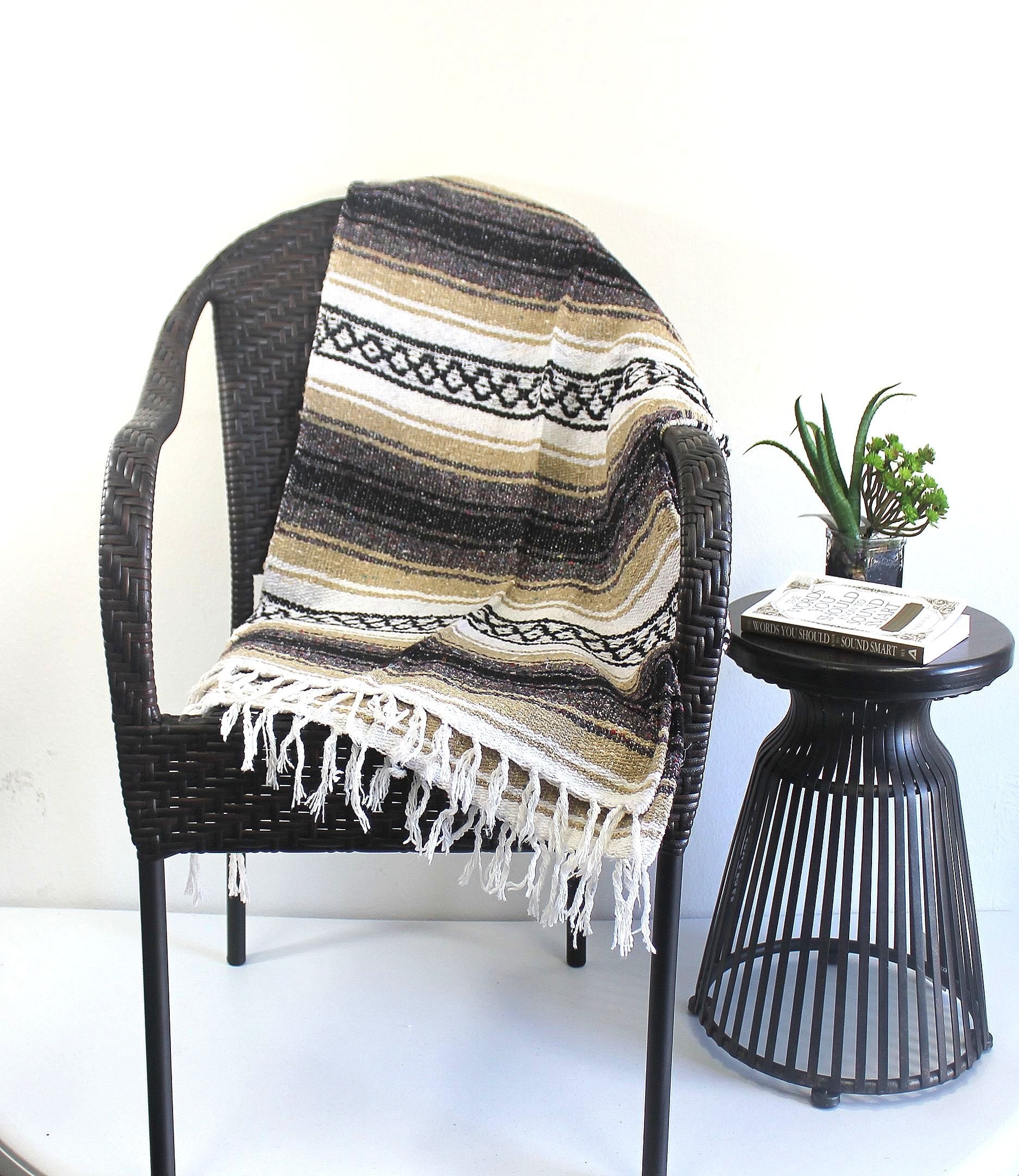 Del Mex Classic Blanket draped over sofa for rustic charm.