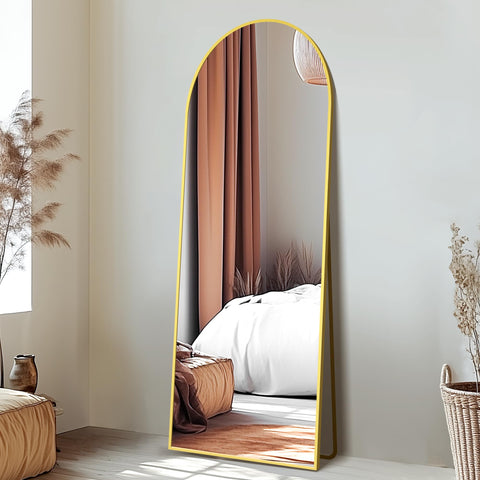 Delma aluminium frame mirror in gold supporting a sturdy freestanding setup