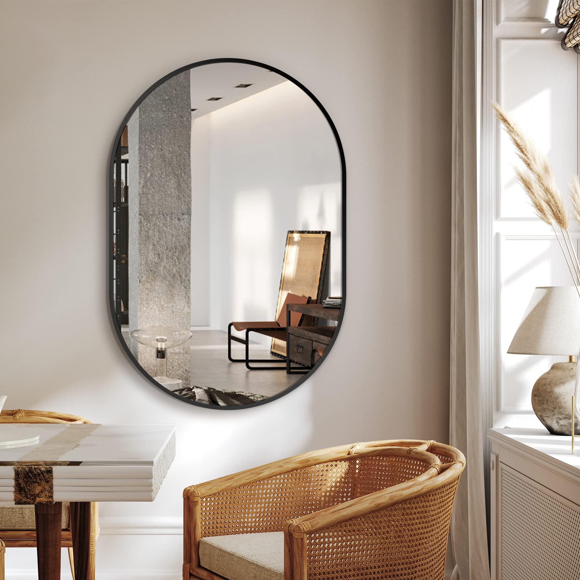 Delma aluminum-frame oval mirror detail adds a durable, modern finish.