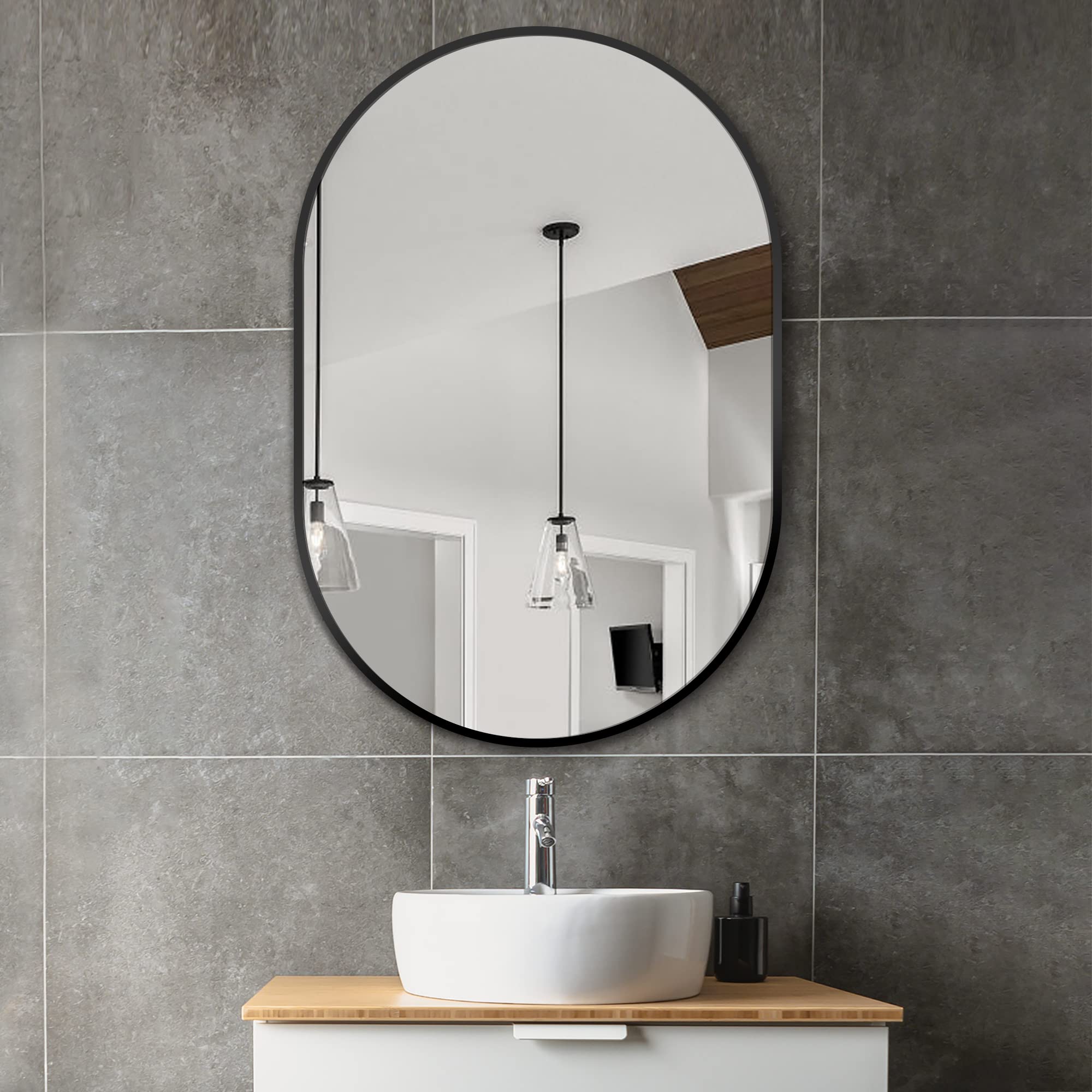 Delma oval mirror 36x24 vertical mount enhances bedroom or entryway decor.