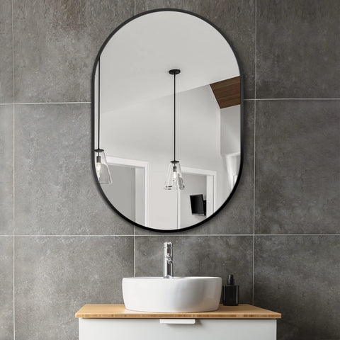 Delma oval mirror 36x24 vertical mount enhances bedroom or entryway decor.