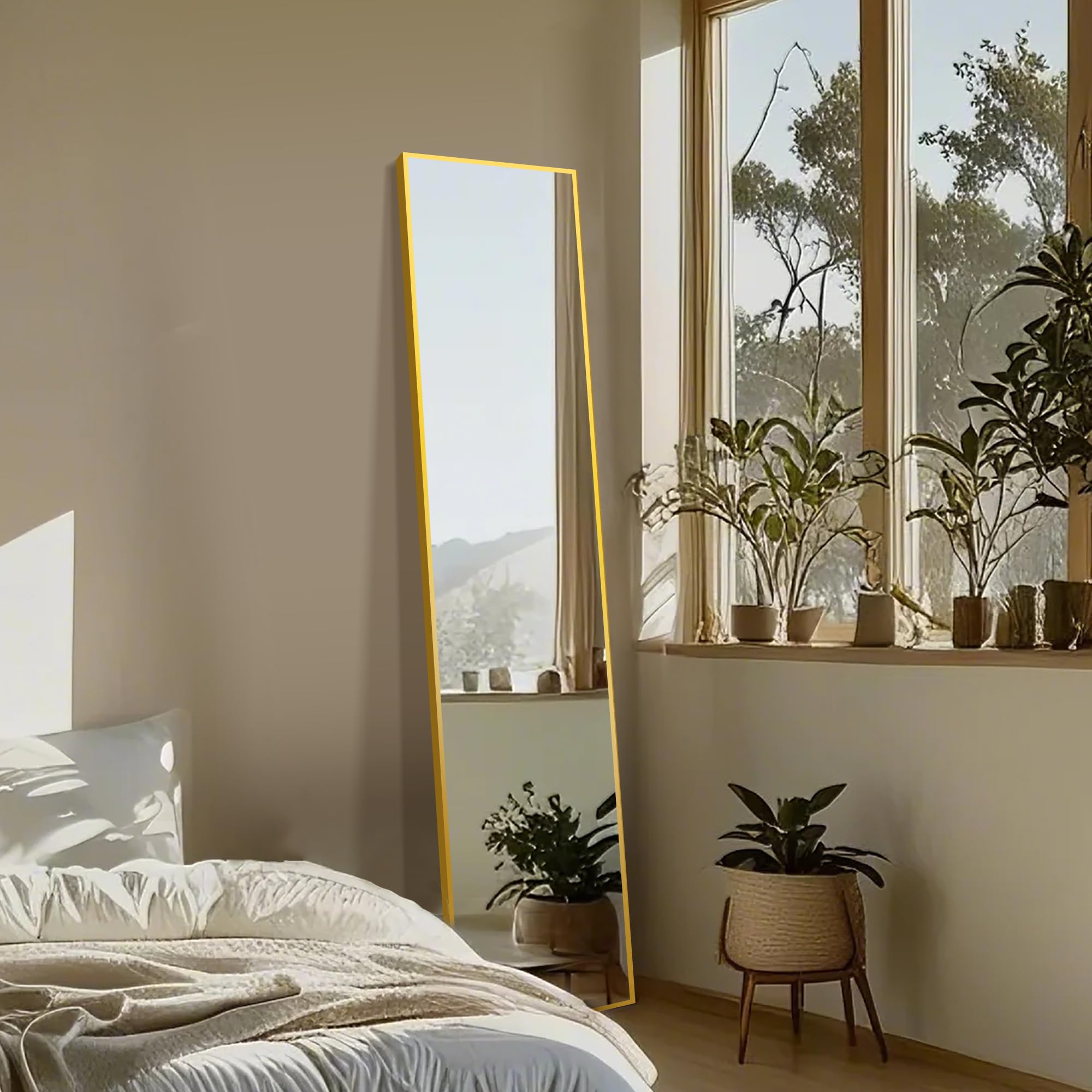 Delma floor mirror with gold aluminum frame adds elegant, versatile styling.