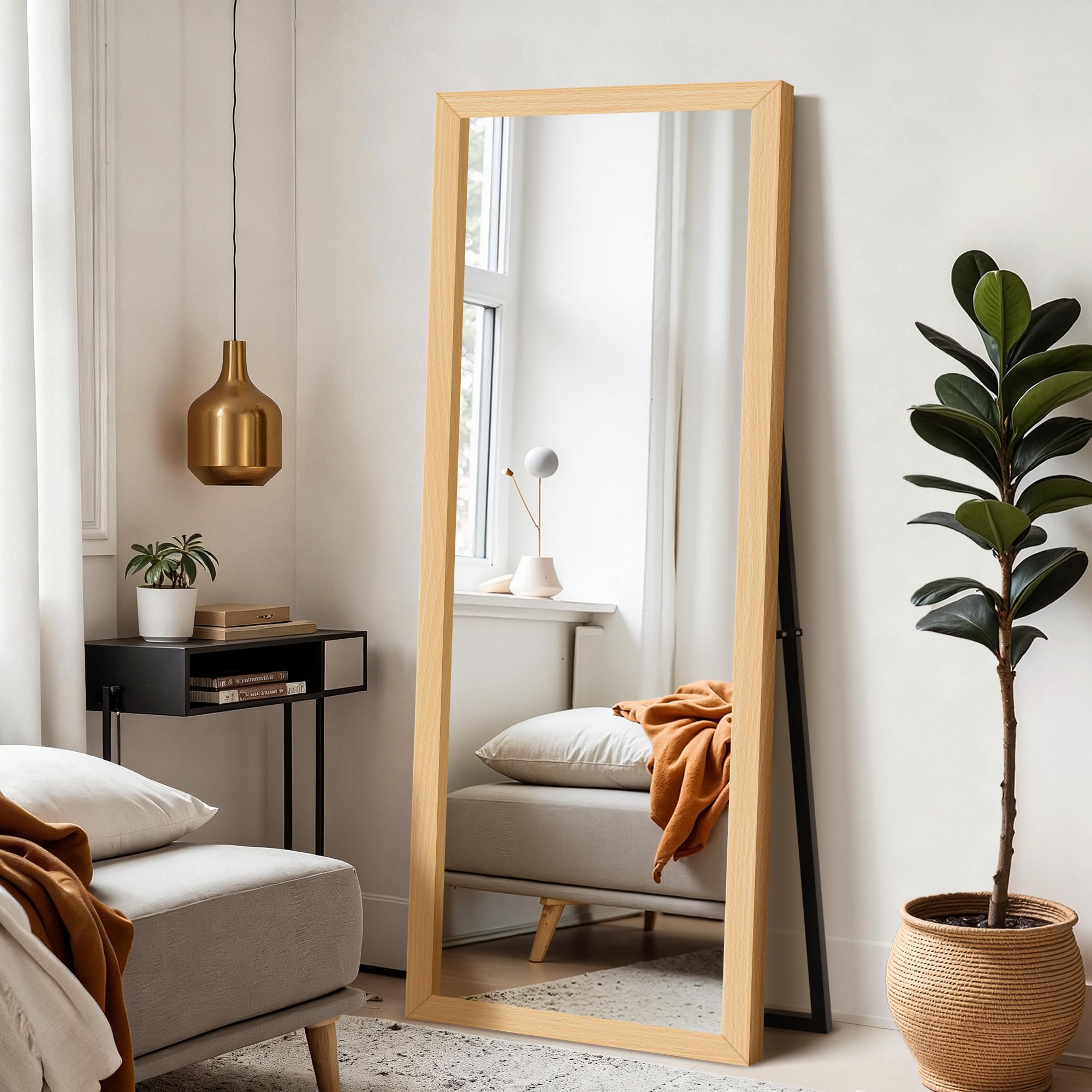 Delma wall full-length mirror with wooden frame and stand for versatile bedroom use.