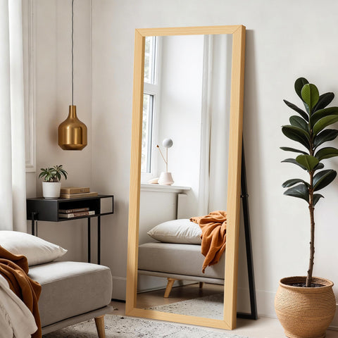 Delma wall full-length mirror with wooden frame and stand for versatile bedroom use.
