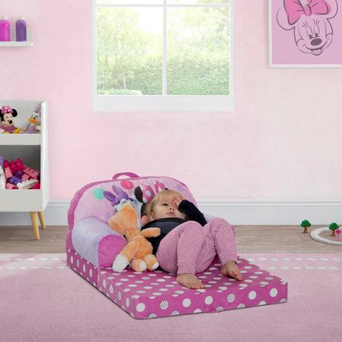 Delta Children Minnie Mouse Cozee Buddy Flip-Out Chair pink converts to a sleeper for naps.