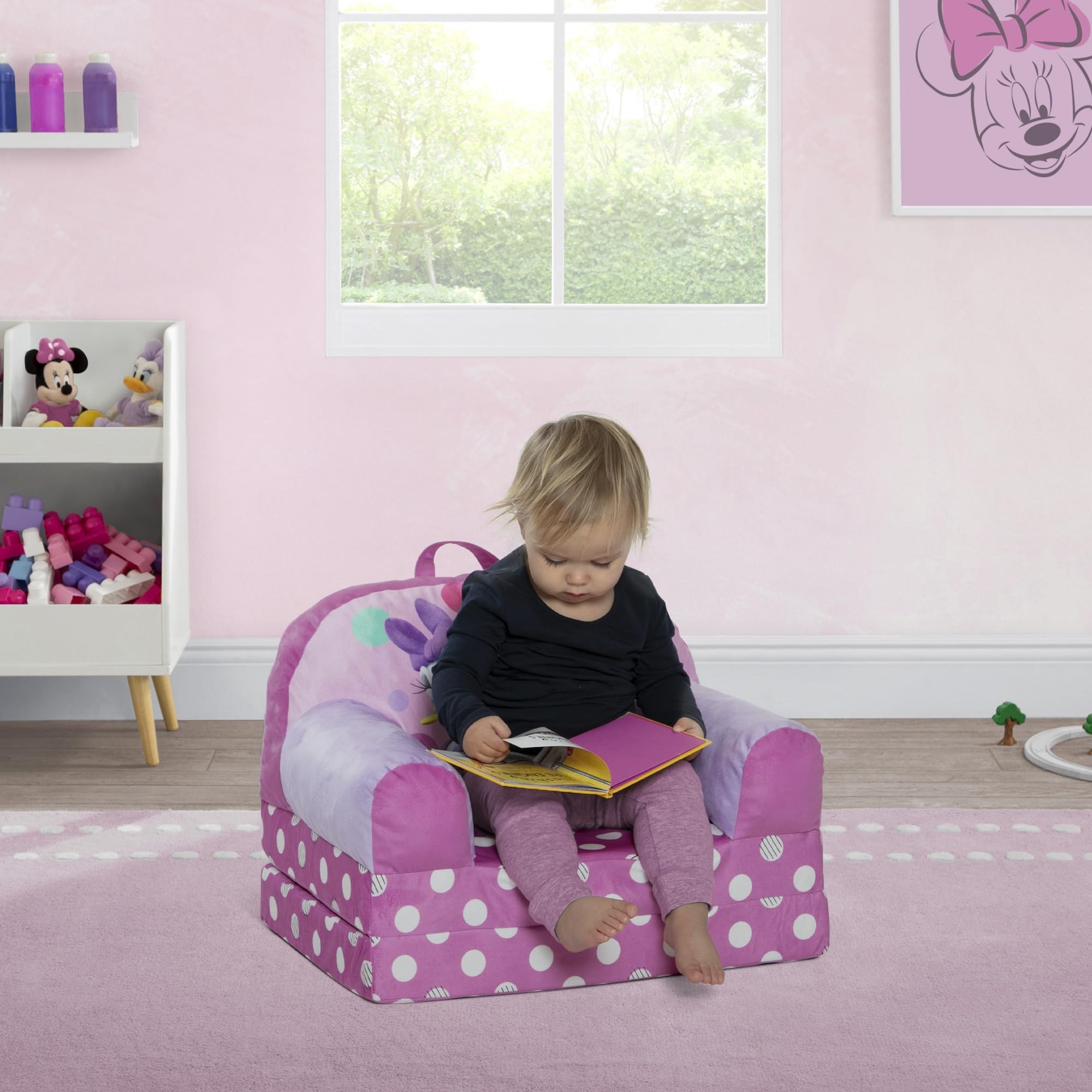 Delta Children Minnie Mouse Cozee Buddy Flip-Out Chair pink is sized for toddlers 18 months and up.