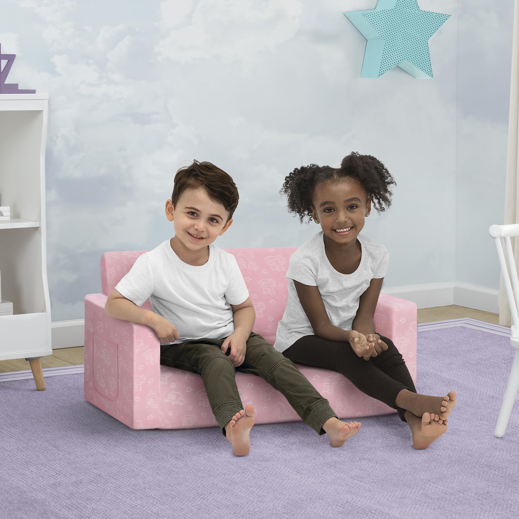 Delta Children Serta Perfect Sleeper Kids 2-Seater Sofa pink convertible in action.