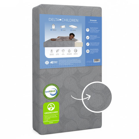 Delta Children Snooze twin memory foam mattress unboxed, ready to expand for sleep.