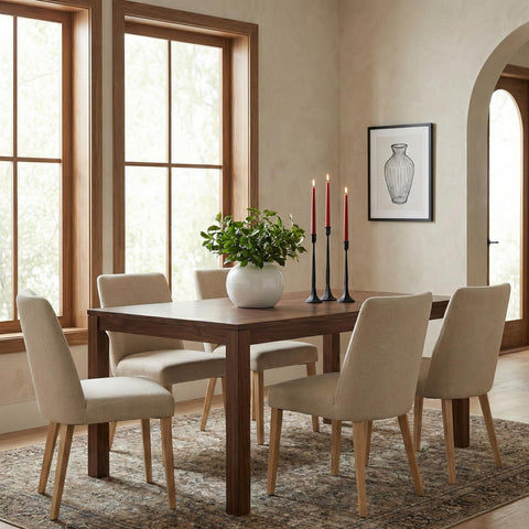 Metal candlesticks create a striking centerpiece on mantels or tabletops