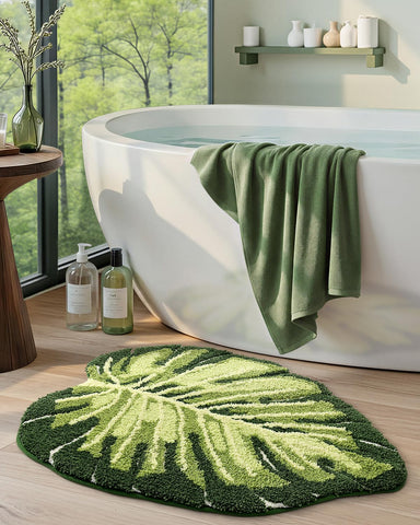 DEXI Monstera leaf rug in bathroom scene, stylish decor touch.