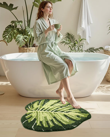 DEXI Monstera leaf rug on tub edge, chic design highlight.