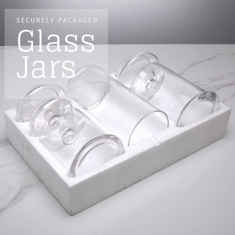 Diamond Star glass apothecary jar bathroom vanity neatly organizing essentials.