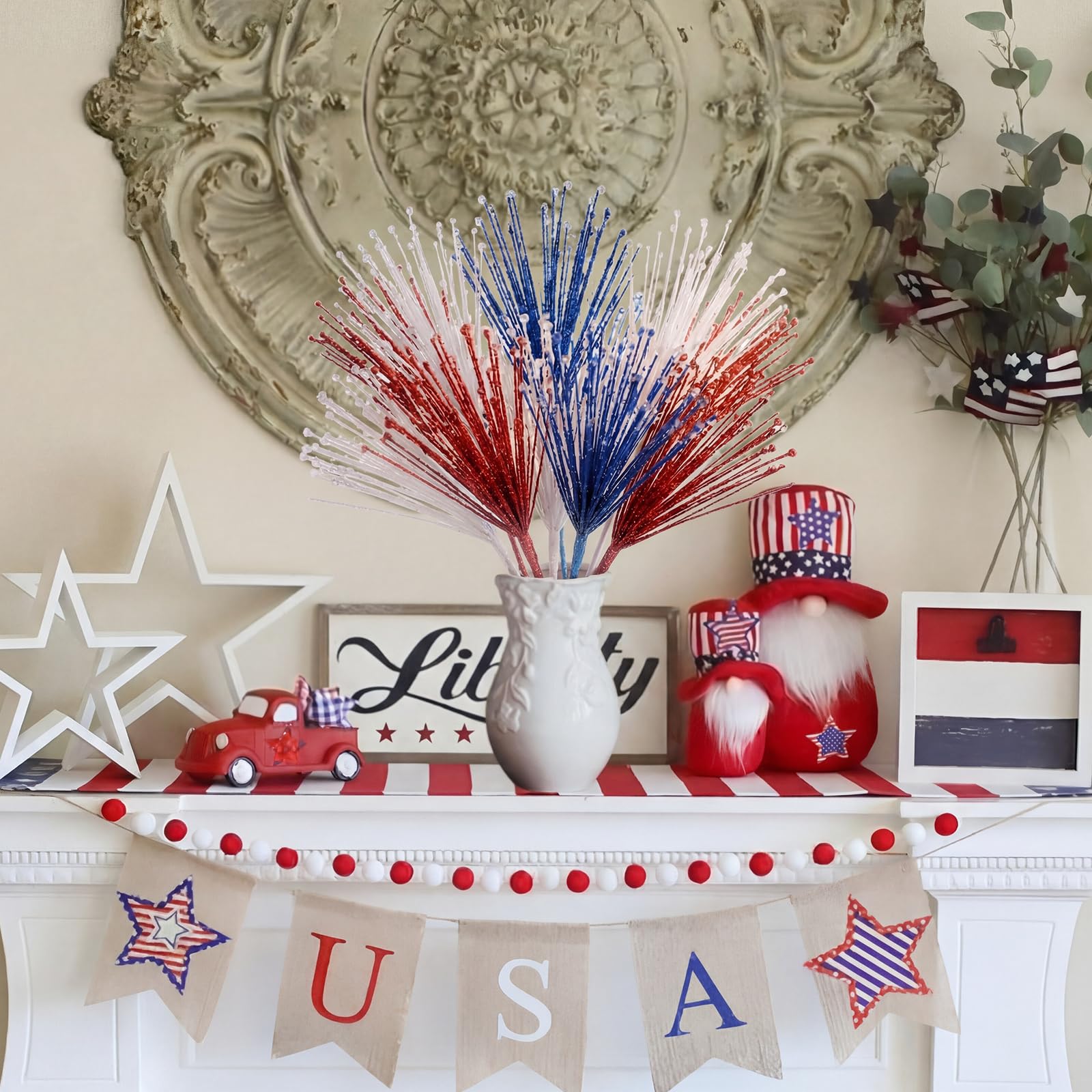 Dingion blue glitter firework picks brighten centerpieces.
