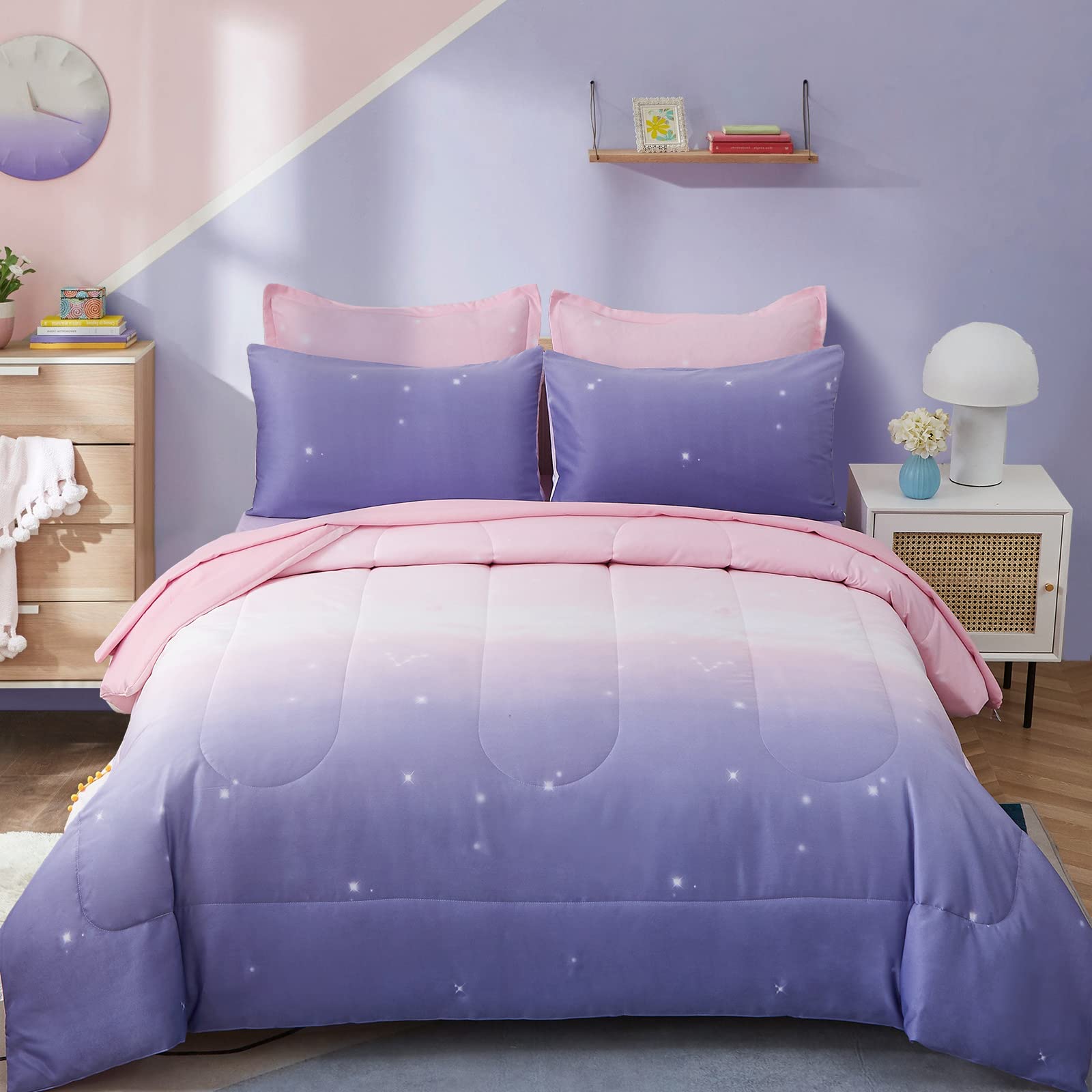Dinjoy rainbow comforter set on a kid's bed with vibrant ombre colors