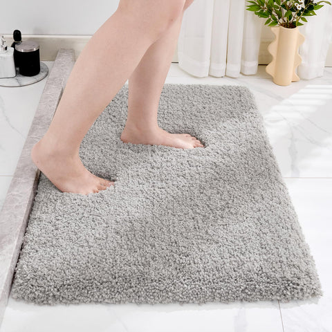 Disolla grey bathroom rug 20x32 provides soft underfoot comfort.
