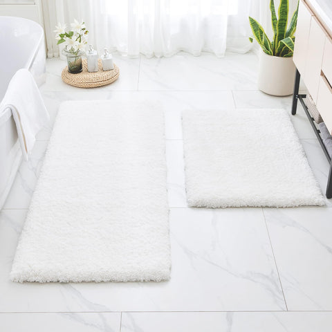 Disolla white bath rug provides soft, absorbent comfort underfoot.