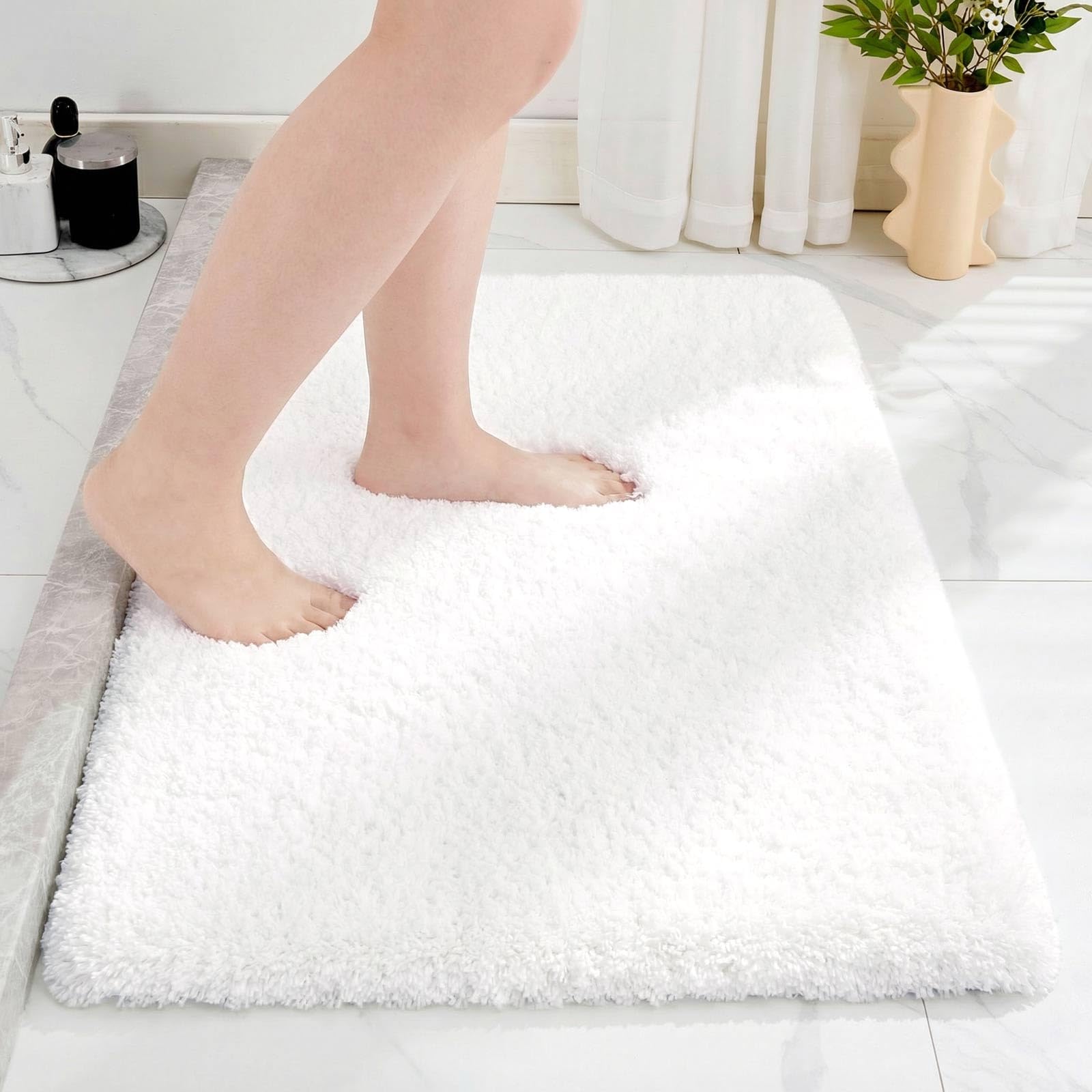 Disolla white bathroom rug 20x32 with plush high-pile texture for absorbent comfort.