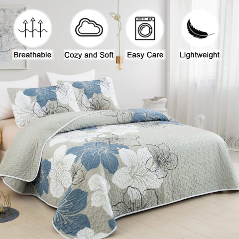 DJY blue floral quilt coverlet close-up highlighting boho stitching