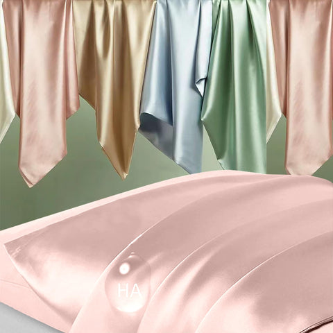 DKBslik coral silk pillowcase on bed with pillow demonstrating color and shine
