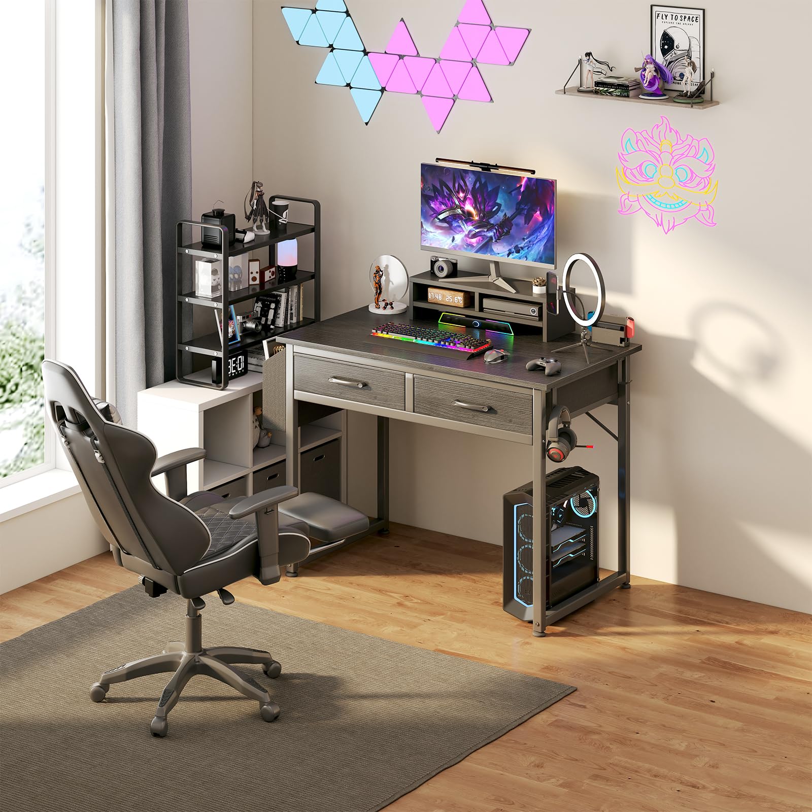 DLisiting gaming desk with drawers supports cables and game gear.