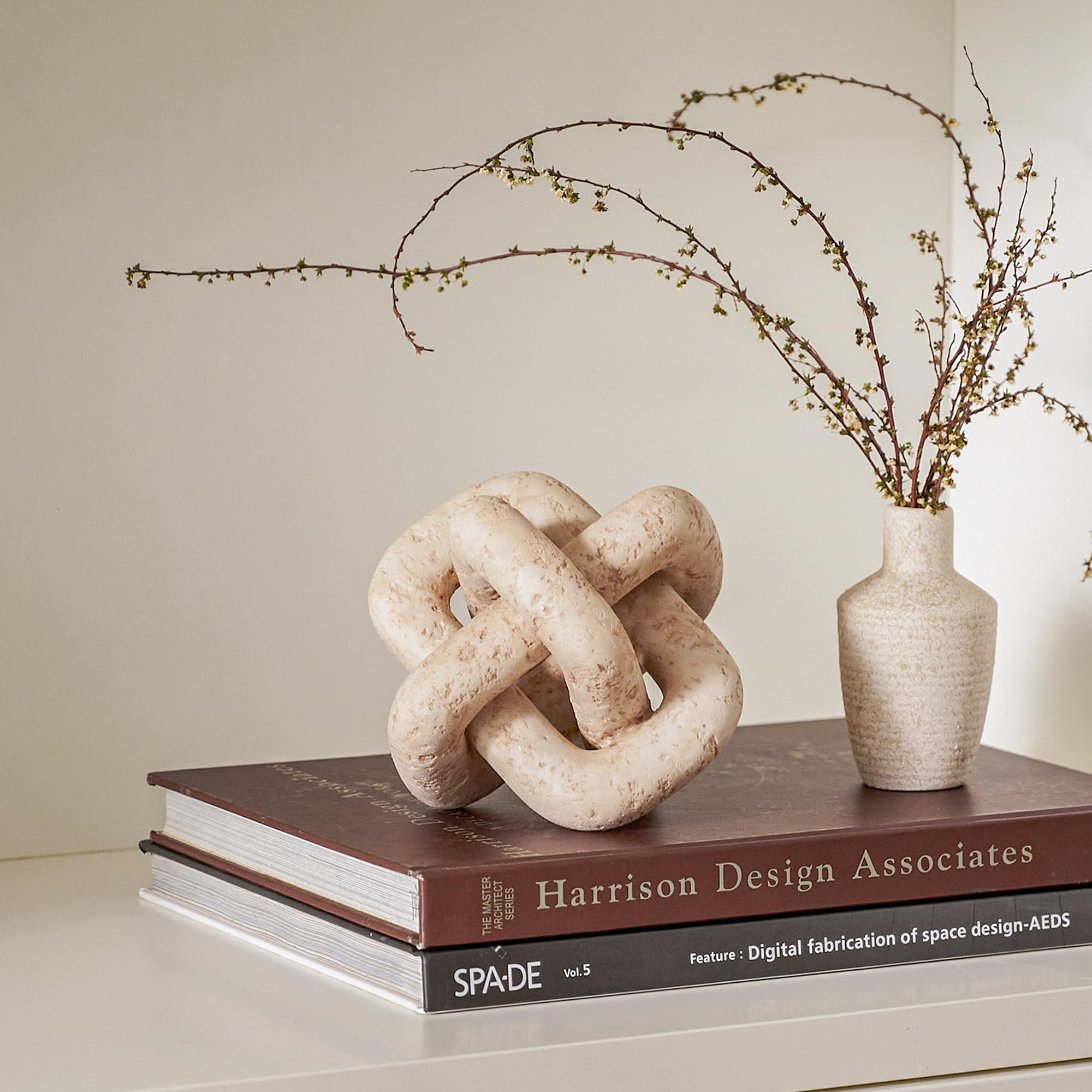 DN DECONATION 3-link knot decor beige travertine on coffee table display, cozy centerpiece