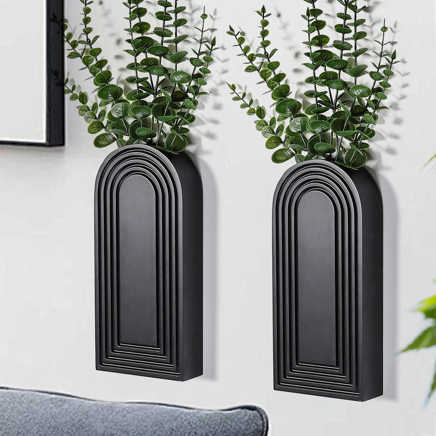 Dnnnii two-pack wall vase in black finish enhances modern farmhouse entryways.