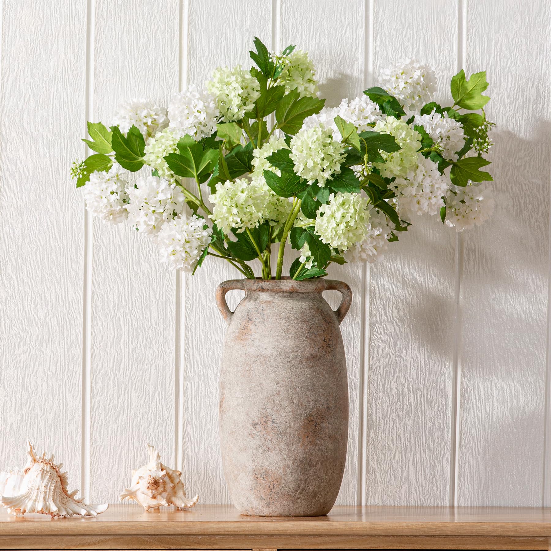 Dobbyby table centerpiece vase elevates dining room decor.