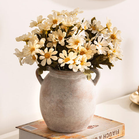 Dobbyby vase with dried flowers creates a warm mantel focal.